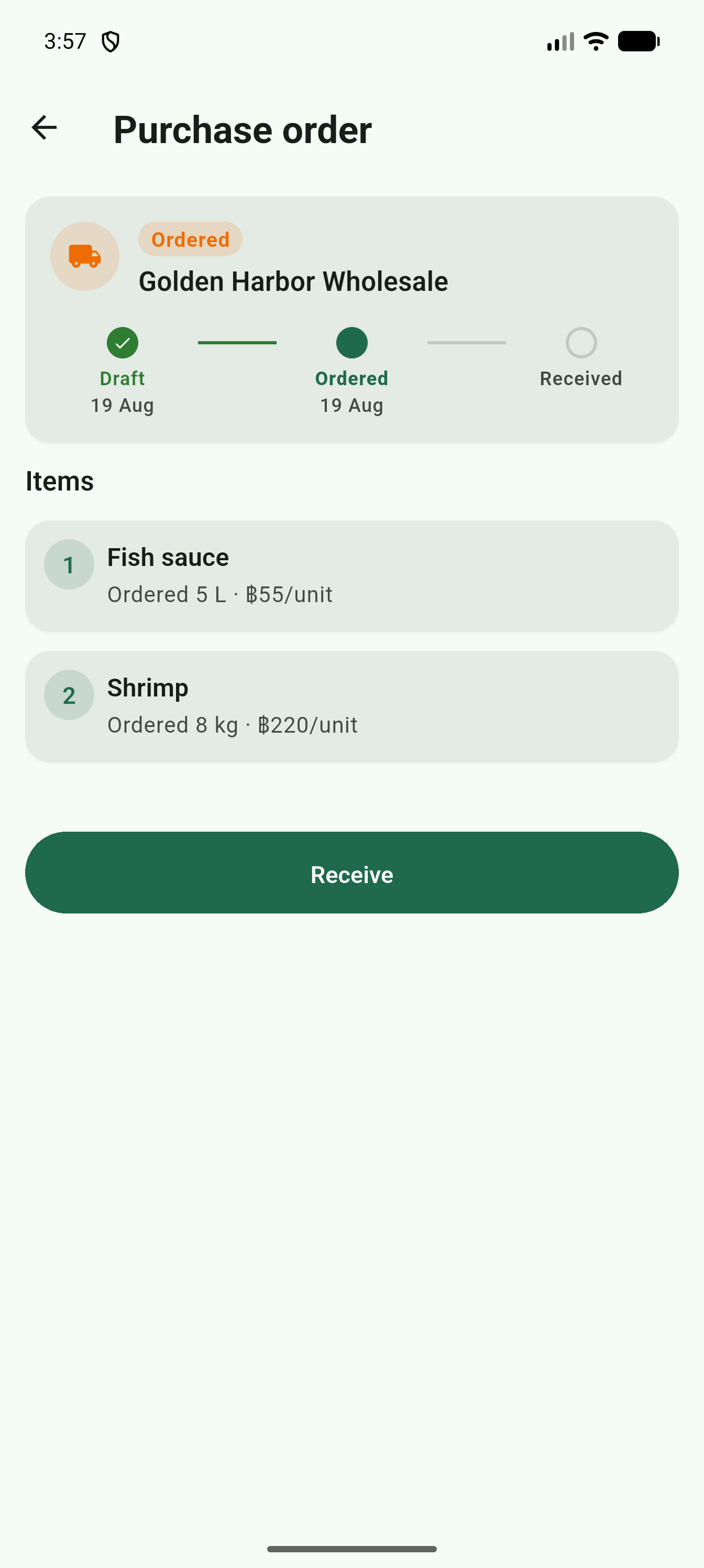 Purchase order detail screen with a status timeline and Receive button